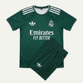 A dark green Real Madrid soccer kit set by Adidas, featuring a short-sleeve jersey with white stripes, the Adidas logo, and Emirates Fly Better sponsor text, paired with matching shorts.