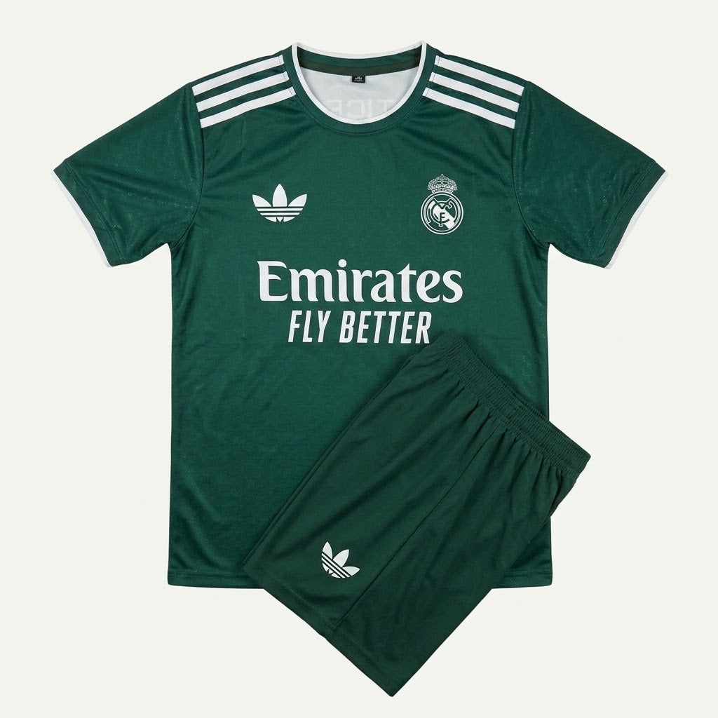 A dark green Real Madrid soccer kit set by Adidas, featuring a short-sleeve jersey with white stripes, the Adidas logo, and Emirates Fly Better sponsor text, paired with matching shorts.